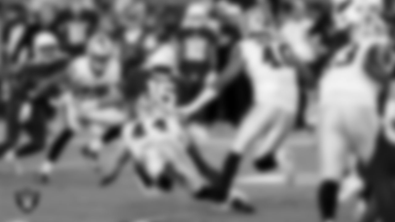 Las Vegas Raiders linebacker Tommy Eichenberg (44) and defensive end Charles Snowden (49) during the preseason away game against the Arizona Cardinals at State Farm Stadium.