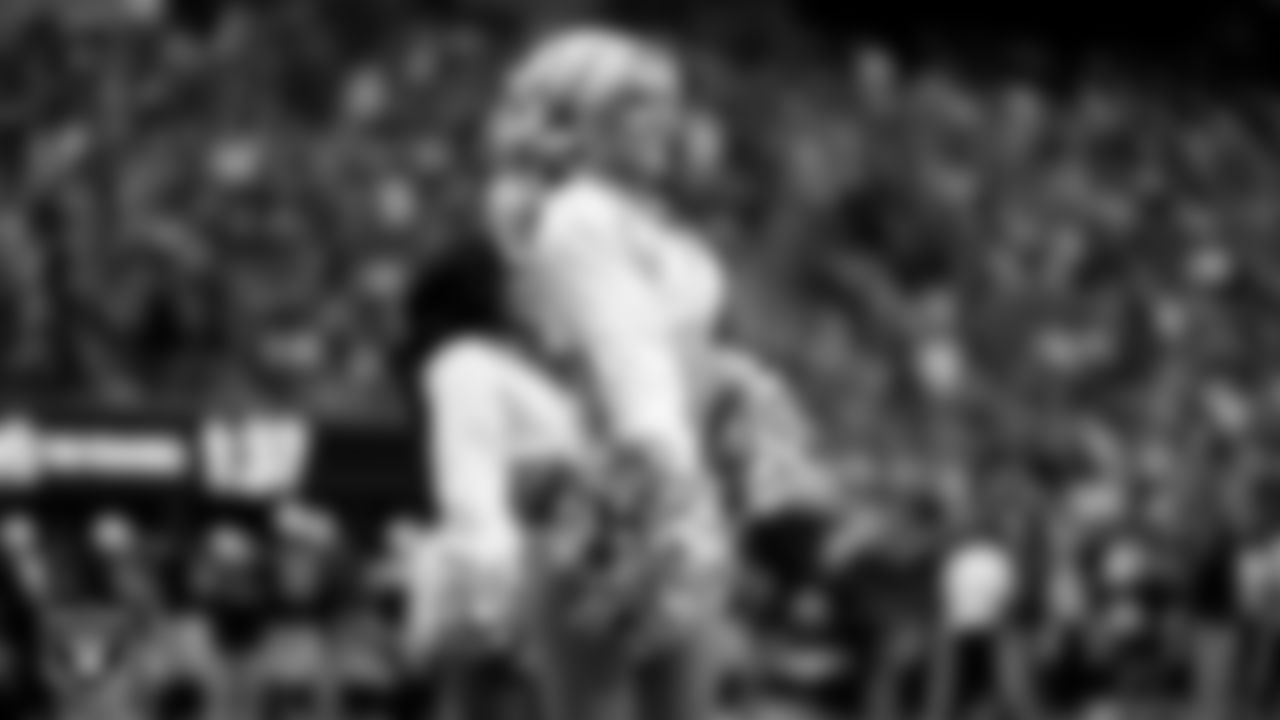 Raiderette Kennedy walks onto the field for a performance during the preseason home game against the San Francisco 49ers at Allegiant Stadium.
