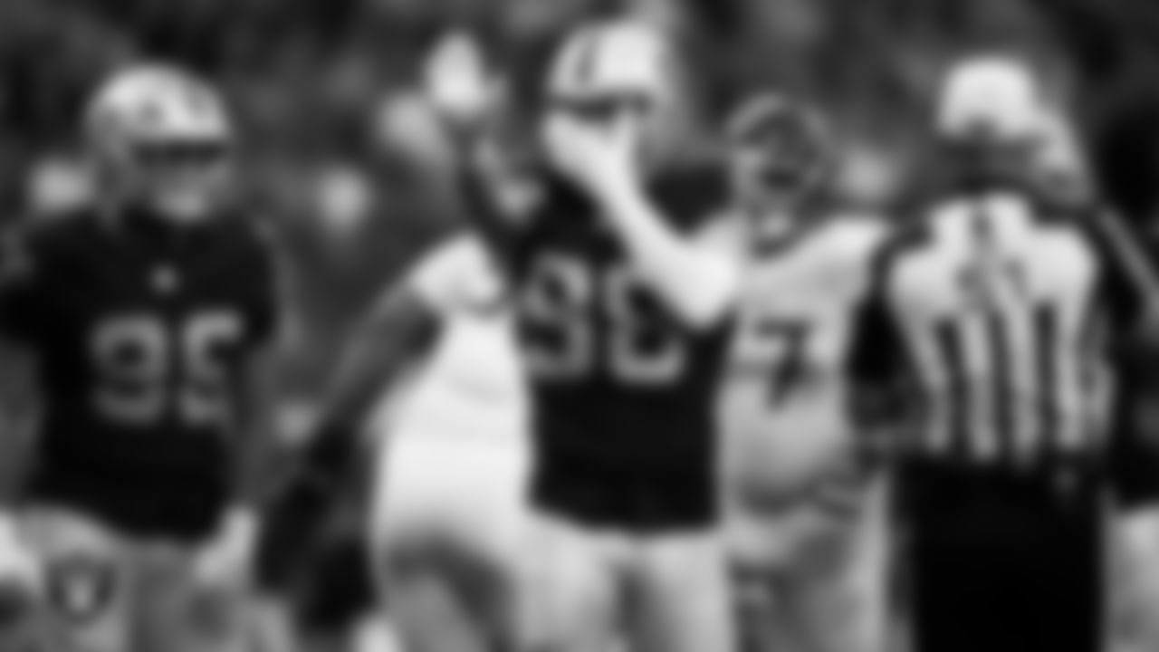 Las Vegas Raiders defensive end Maxx Crosby (98) celebrates after sacking the quarterback during the regular season home game against the Tennessee Titans at Allegiant Stadium.