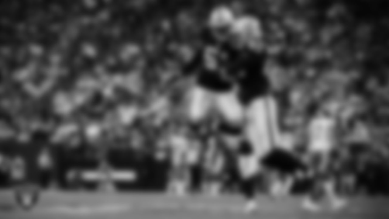Las Vegas Raiders defensive end Charles Snowden (49) celebrates with defensive end Malcolm Koonce (51) after sacking the quarterback during the regular season home game against the Kansas City Chiefs at Allegiant Stadium.