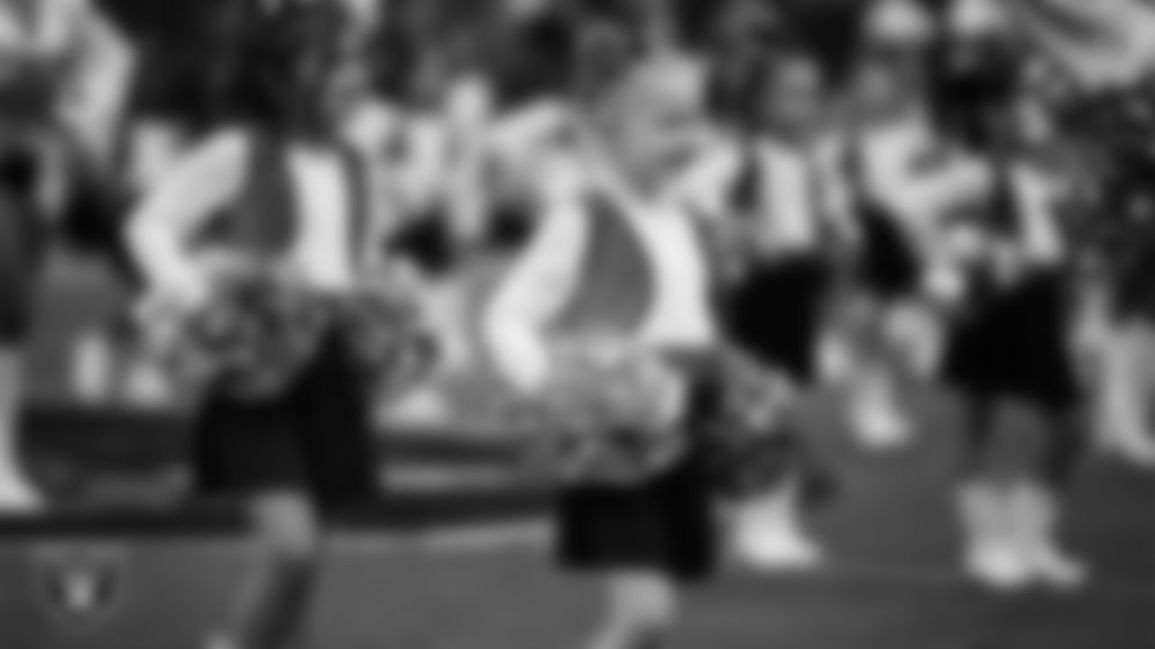 Junior Raiderettes perform on the field before the preseason home game against the San Francisco 49ers at Allegiant Stadium.