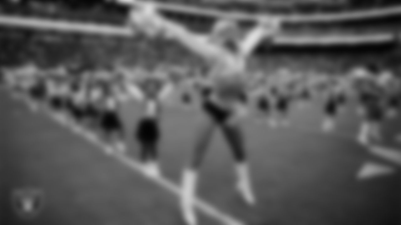 Raiderette Kennedy and Junior Raiderettes perform on the field before the preseason home game against the San Francisco 49ers at Allegiant Stadium.