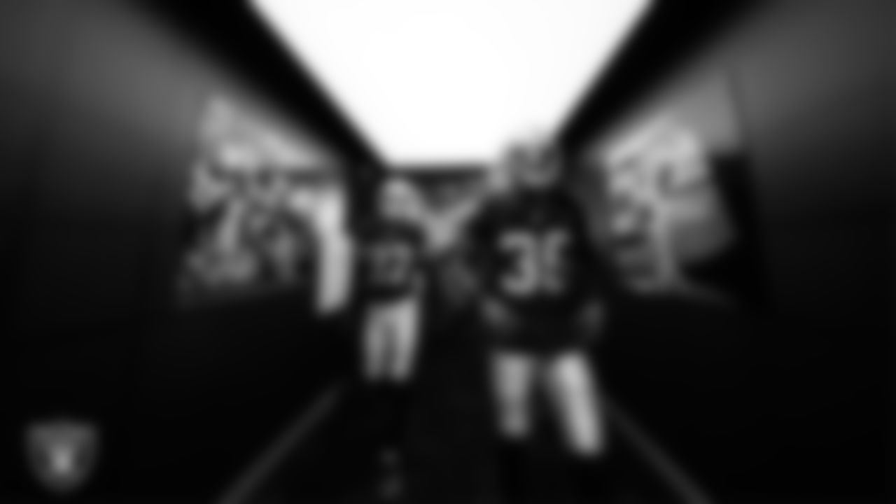 Las Vegas Raiders safety Tristin McCollum (27) and cornerback Kyu Blu Kelly (36) walk down the tunnel before the regular season home game against the Denver Broncos at Allegiant Stadium.