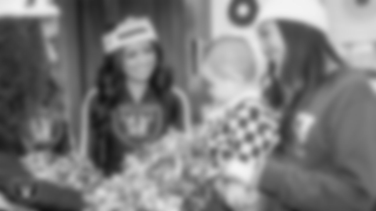 Raiderette Sloane with an attendee during a toy drive at Intermountain Health Primary Children's Hospital.