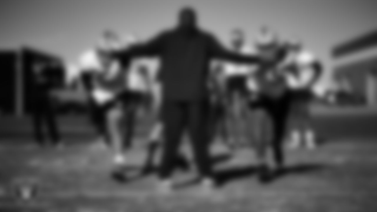 Las Vegas Raiders defensive tackle Jonah Laulu (96), assistant defensive line coach Kenyon Jackson and defensive tackle Tonka Hemingway (97) during practice at Intermountain Health Performance Center.