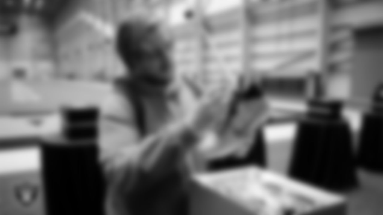 Las Vegas Raiders guard Alex Cappa (65) unboxes his custom cleats for the NFL's My Cause My Cleats initiative at Intermountain Health Performance Center.