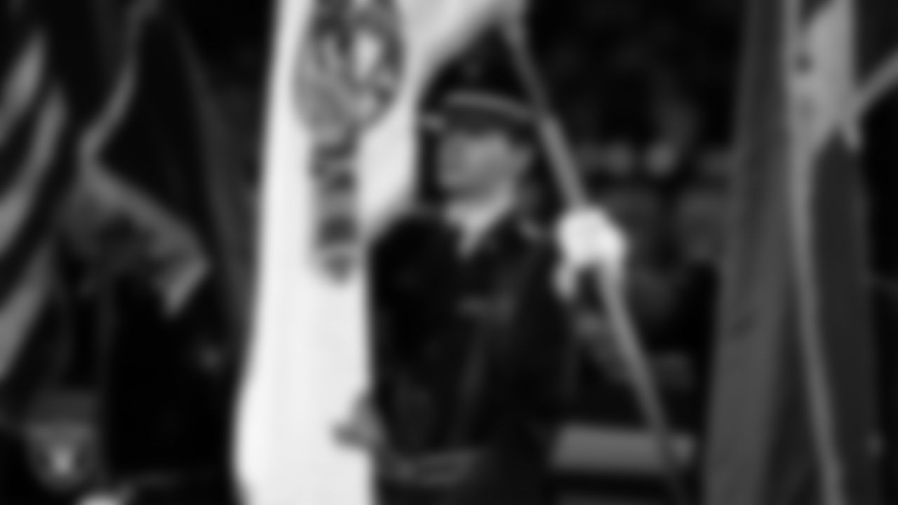 The Rancho High School Air Force JROTC Honor Guard presents the nation's colors during the national anthem before the Las Vegas Raiders' regular season home game against the Dallas Cowboys at Allegiant Stadium.