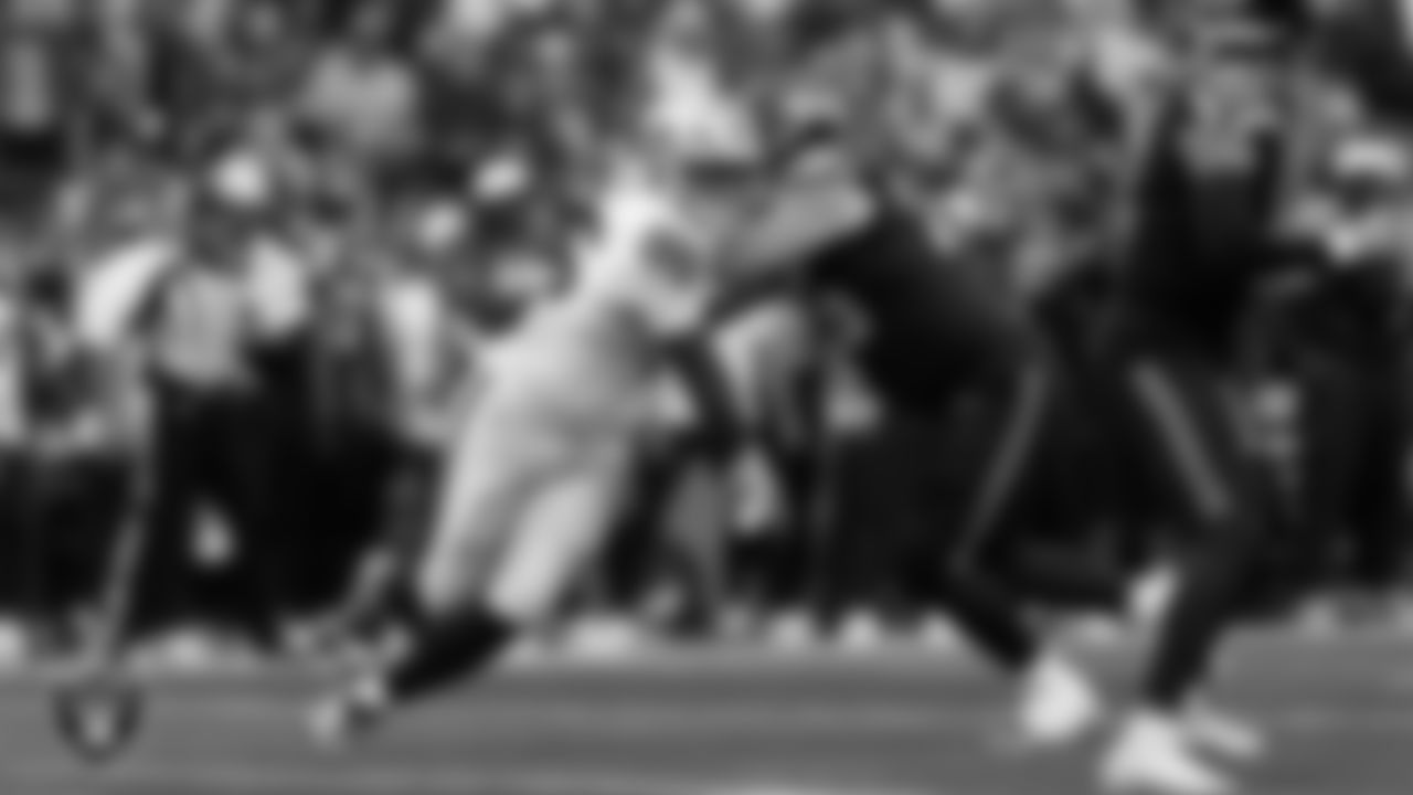 Las Vegas Raiders defensive tackle Jonah Laulu (96) pressures the quarterback during the preseason away game against the Seattle Seahawks at Lumen Field.