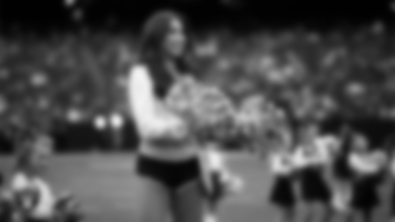Raiderette Meekela and Junior Raiderettes perform on the field before the preseason home game against the San Francisco 49ers at Allegiant Stadium.