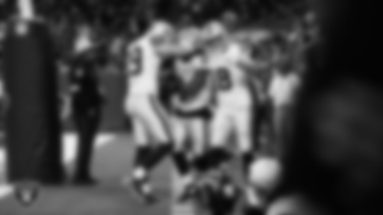 Las Vegas Raiders running back Ashton Jeanty (2) celebrates with teammates after rushing for a 51-yard touchdown during the regular season away game against the Houston Texans at NRG Stadium.