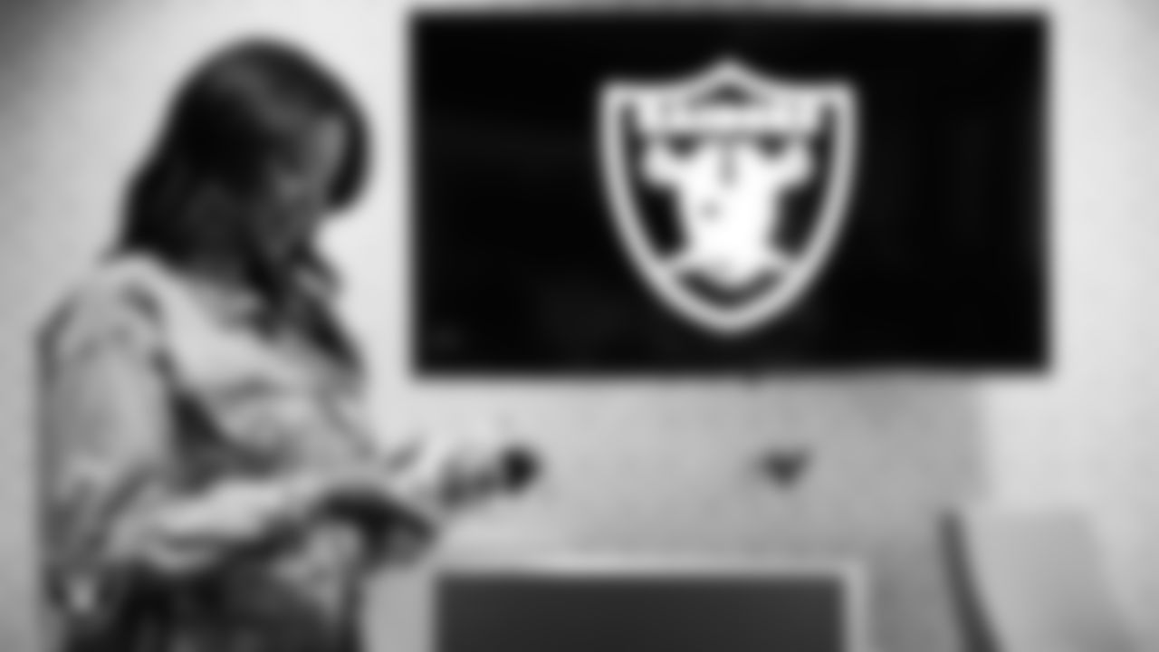 Las Vegas Raiders President Sandra Douglass Morgan unboxes her custom shoes for the NFL's My Cause My Cleats initiative at Intermountain Health Performance Center.