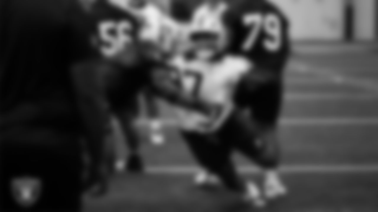 Las Vegas Raiders tackle Charles Grant (60) and defensive tackle Tonka Hemingway (97) during practice at Intermountain Health Performance Center.