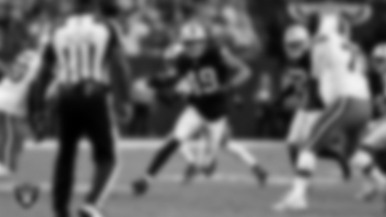 Las Vegas Raiders defensive end Charles Snowden (49) runs after intercepting a pass during the regular season home game against the Cleveland Browns at Allegiant Stadium.