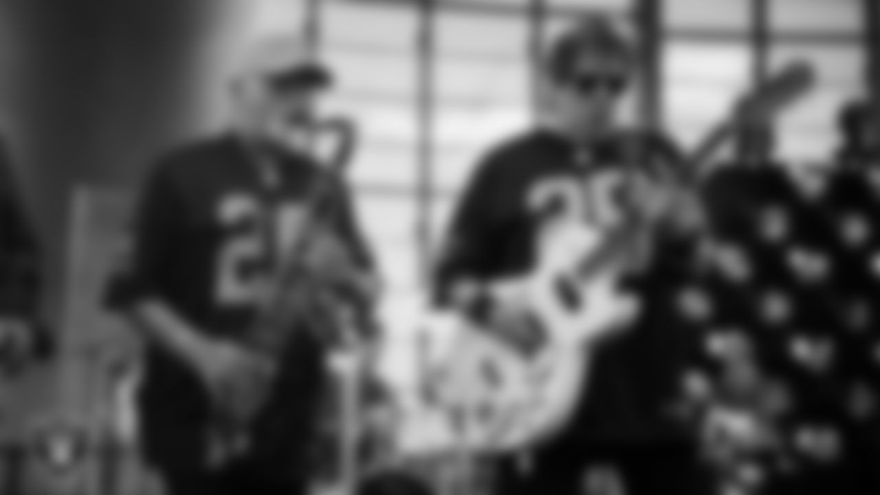 Singer and songwriter George Thorogood and musician Buddy Leach perform during halftime at the Las Vegas Raiders' preseason home game against the San Francisco 49ers at Allegiant Stadium.
