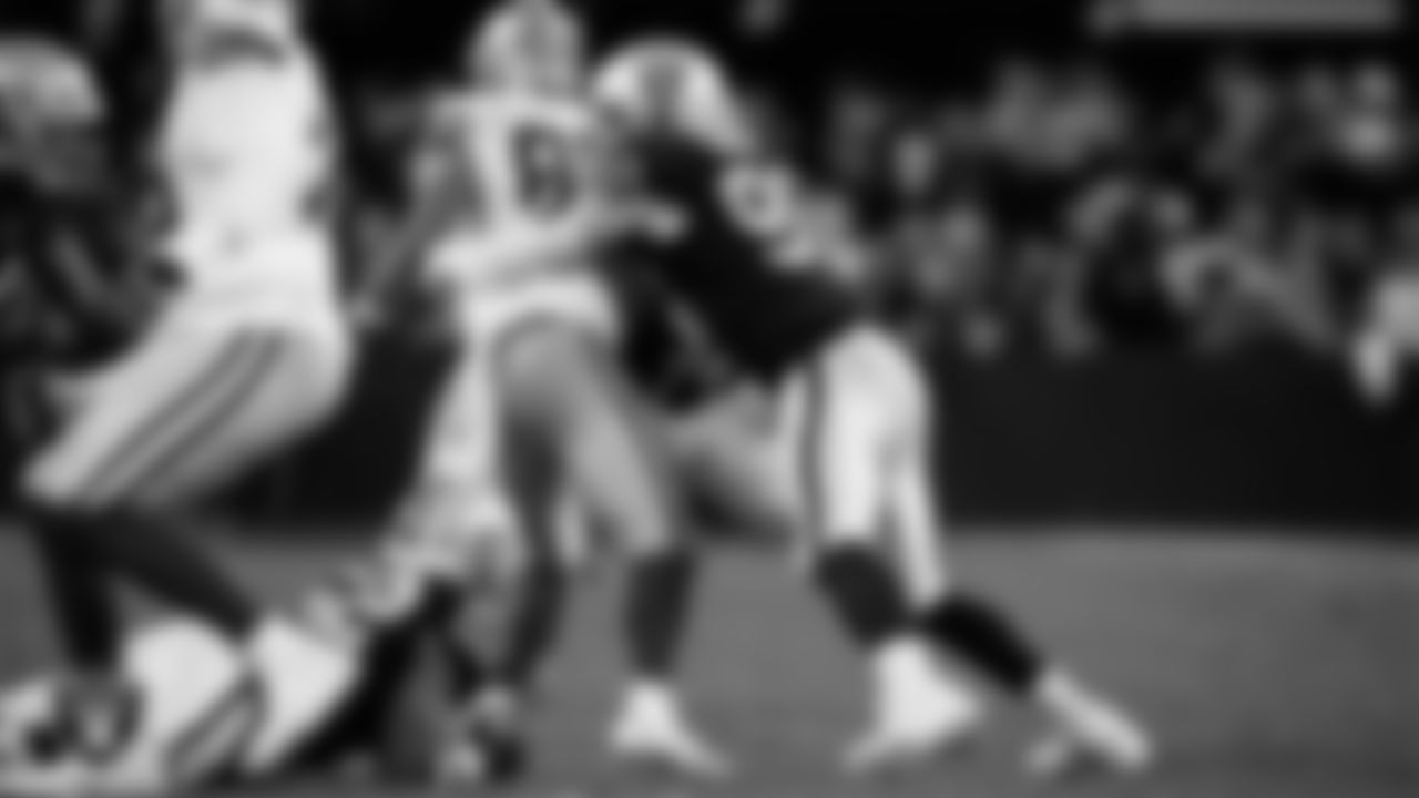 Las Vegas Raiders defensive end Maxx Crosby (98) makes a tackle during the regular season home game against the Dallas Cowboys at Allegiant Stadium.