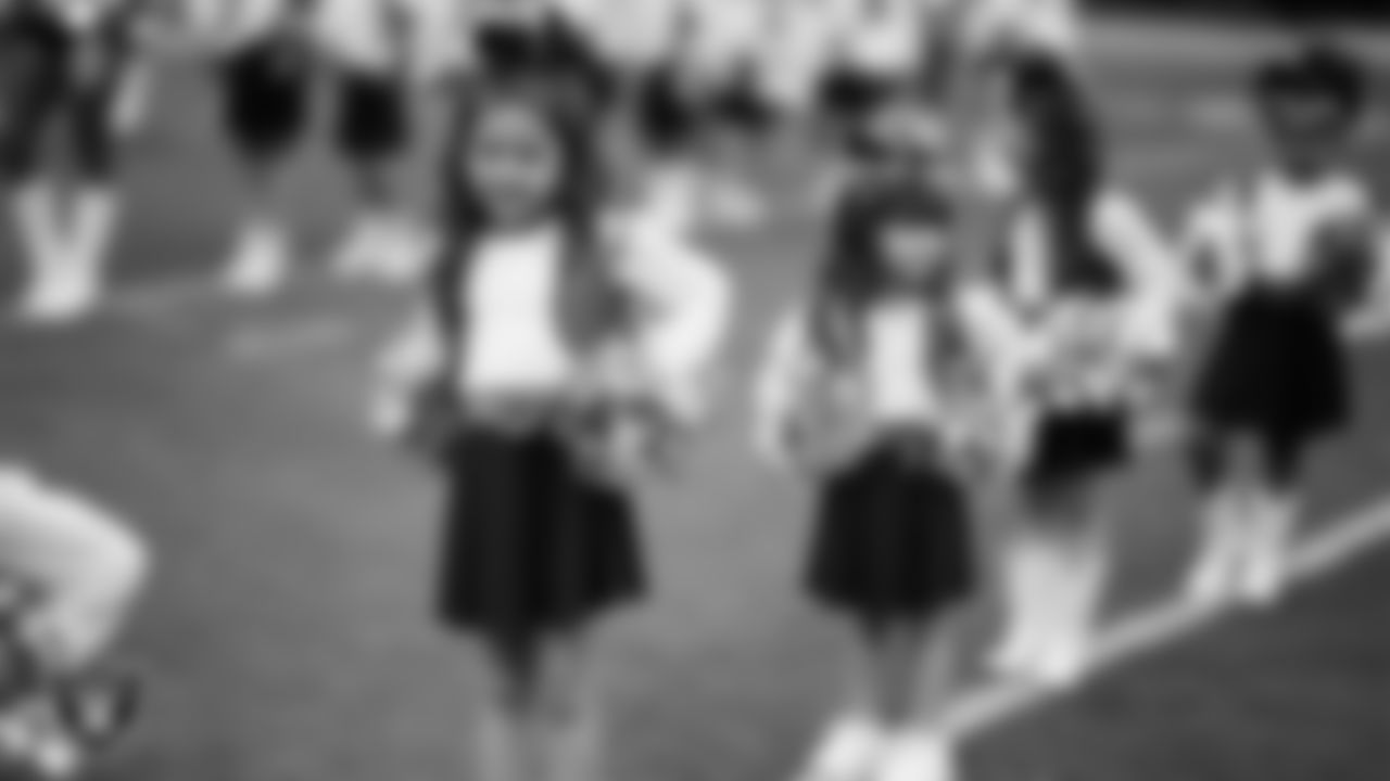 Junior Raiderettes perform on the field before the preseason home game against the San Francisco 49ers at Allegiant Stadium.