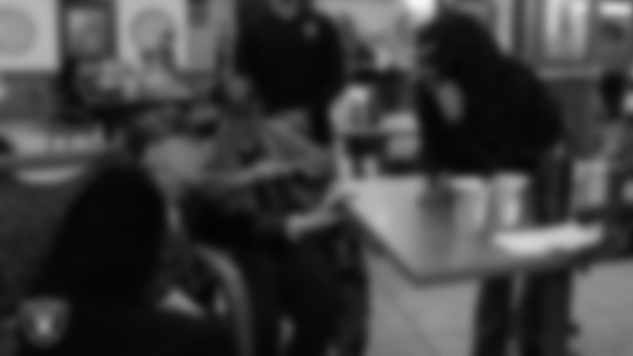 Las Vegas Raiders senior manager of corporate partnership activation Jamie Gary speaks to veterans during the annual Cox Salute to Service Tailgate at Southern Nevada State Veterans Home.