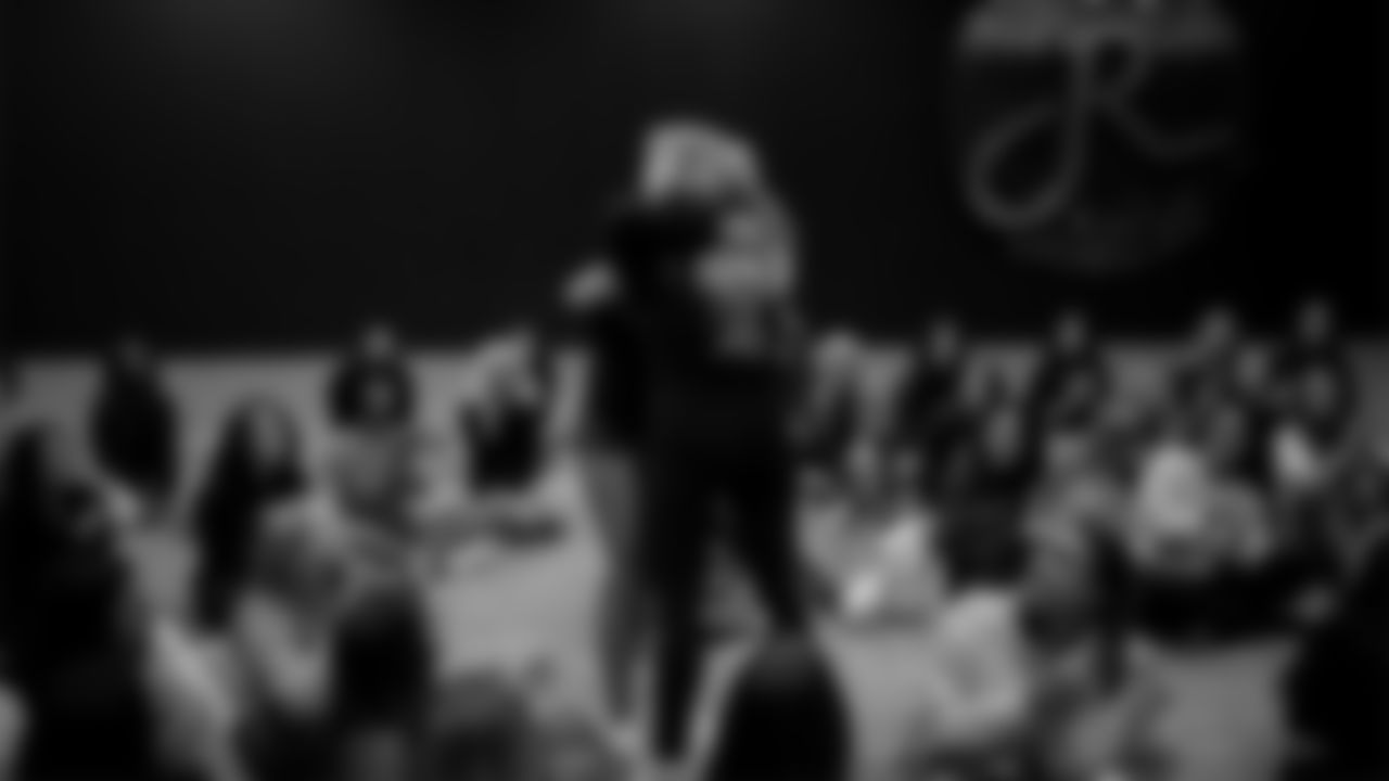 Raiderettes Director Tiphanie McNiff presents a Silver Ticket to a dancer during a recruitment clinic at The Studio.