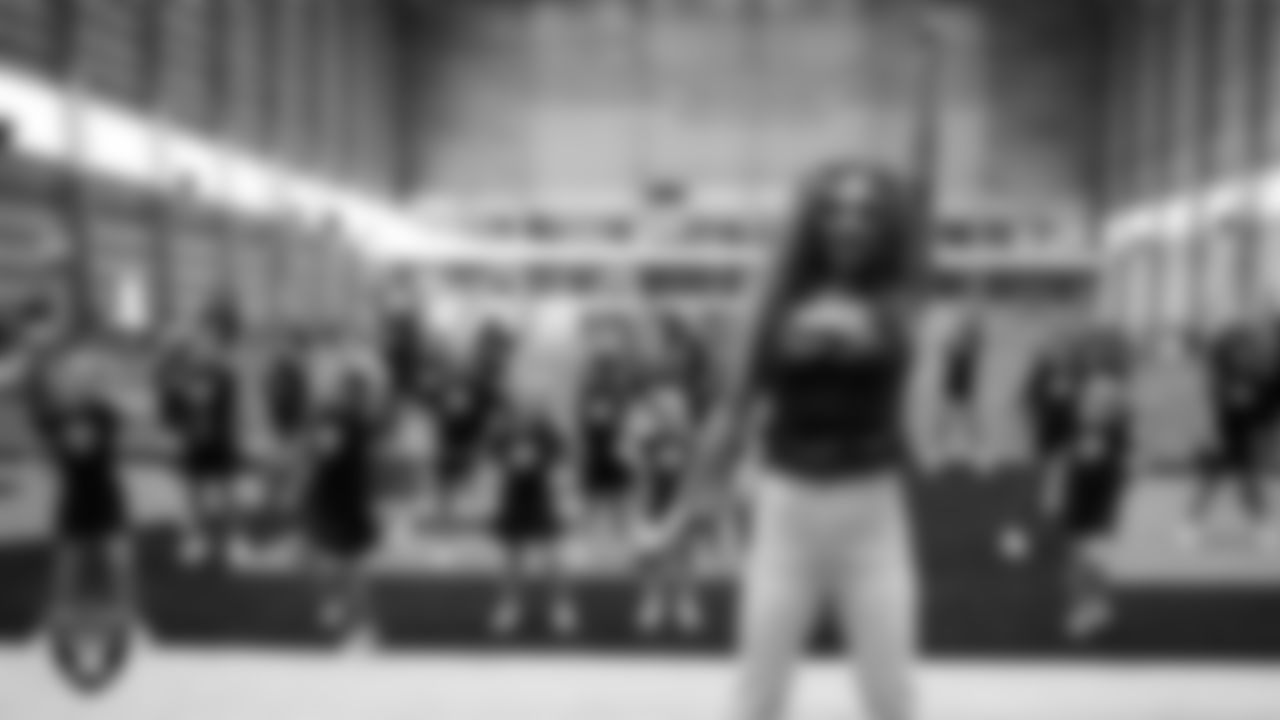 Raiderette Lexie with dancers during day three of summer camp at Intermountain Health Performance Center.