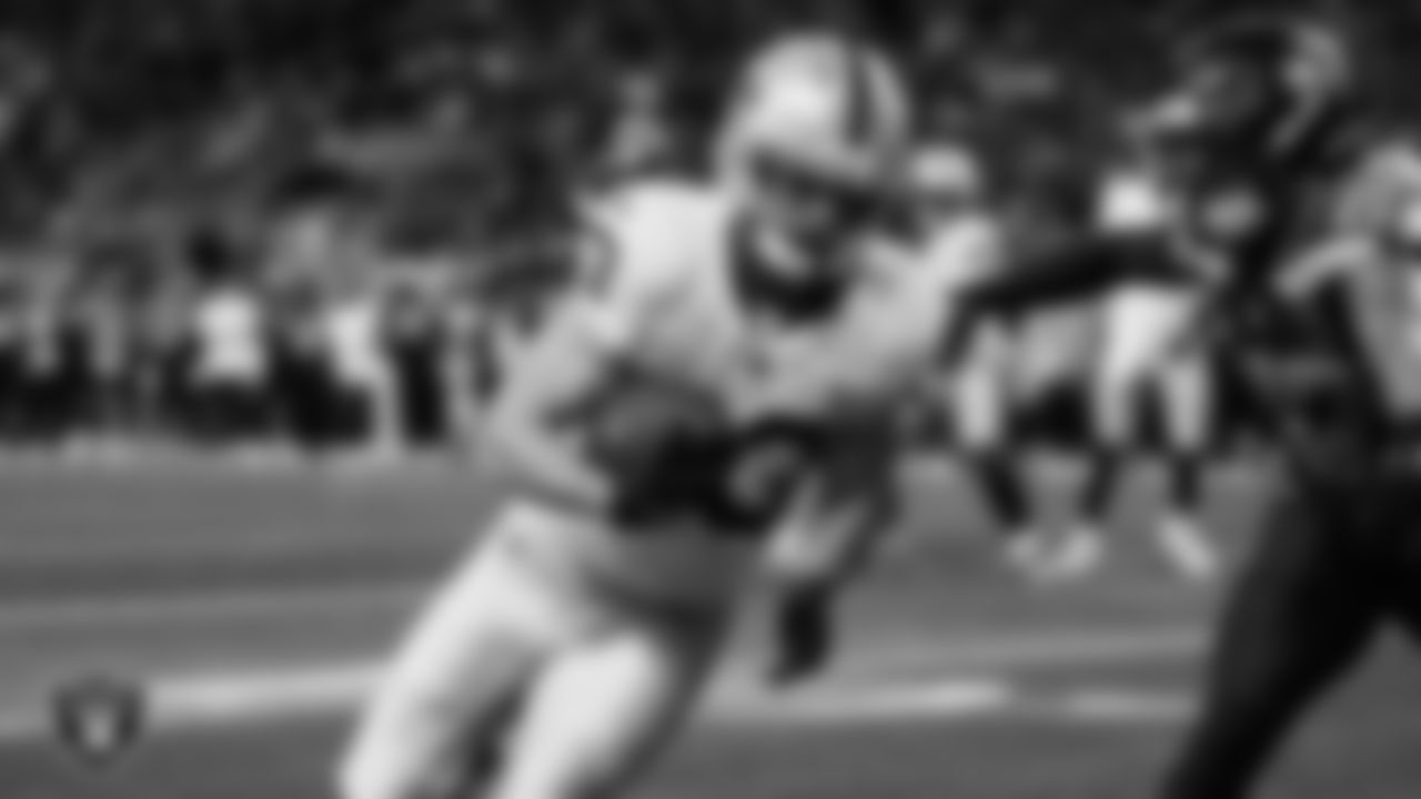 Las Vegas Raiders running back Dylan Laube (23) runs after making a 6-yard touchdown catch during the preseason away game against the Seattle Seahawks at Lumen Field.