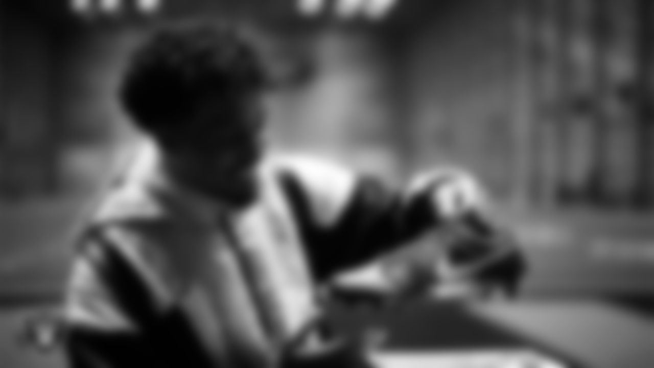 Las Vegas Raiders safety Isaiah Pola-Mao (20) unboxes his custom cleats for the NFL's My Cause My Cleats initiative at Intermountain Health Performance Center.