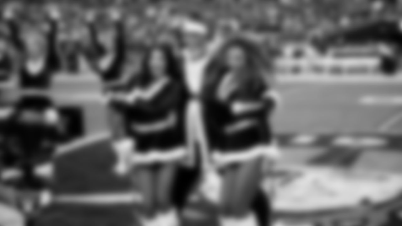 Raiderettes Kylee and Lexie and dancer Oscar Ortega-Hernandez perform on the field before the regular season home game against the New York Giants at Allegiant Stadium.
