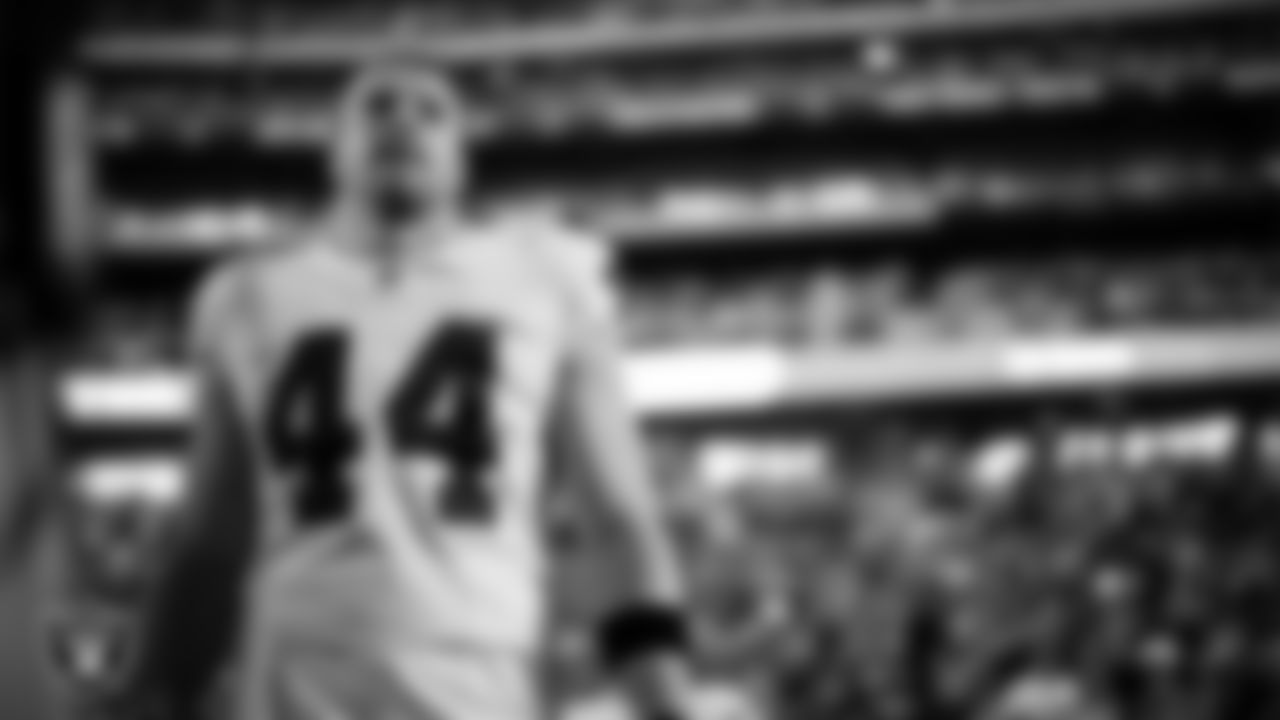 on the sidelines before the Las Vegas Raiders' regular season away game against the Indianapolis Colts at Lucas Oil Stadium.