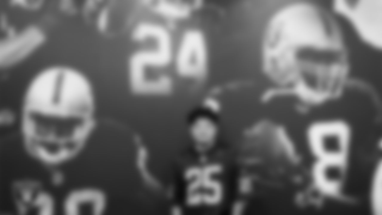 Marcos Carrillo from Make-A-Wish poses for a photo in the team room during a visit to Intermountain Health Performance Center.