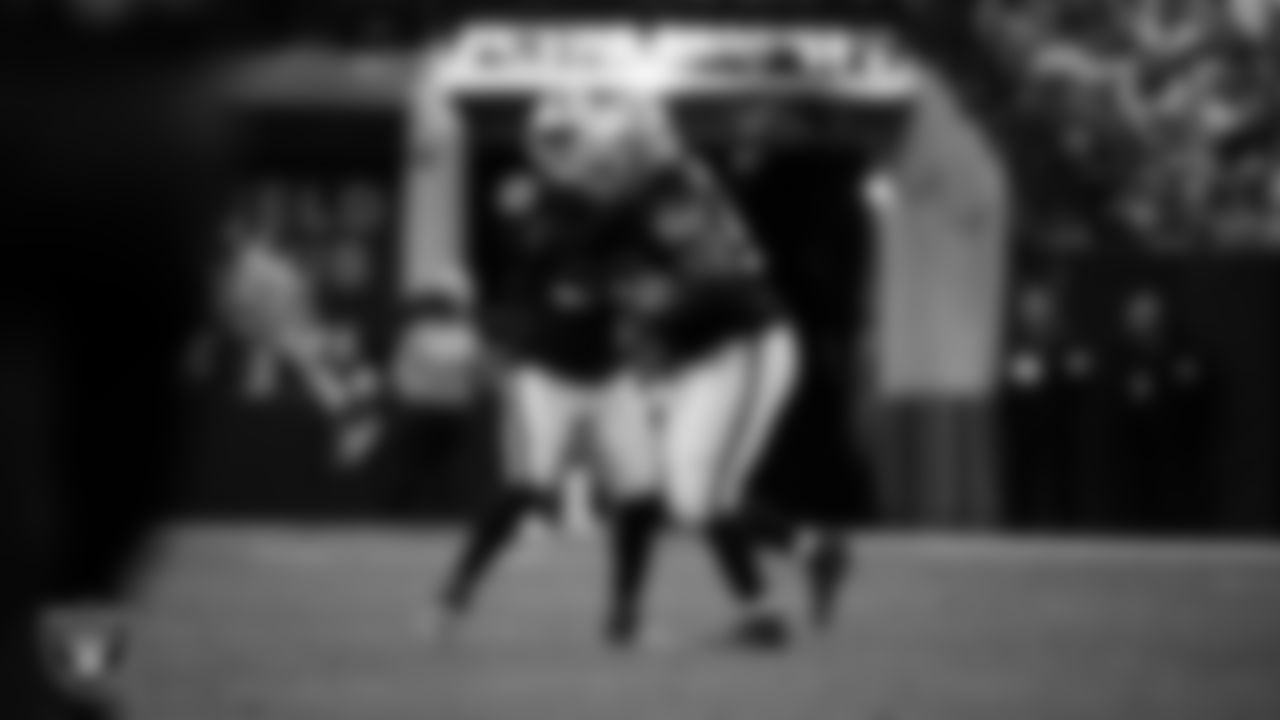 Las Vegas Raiders defensive tackle JJ Pegues (92) celebrates with linebacker Elandon Roberts (52) after recovering a fumble during the regular season home game against the Kansas City Chiefs at Allegiant Stadium.