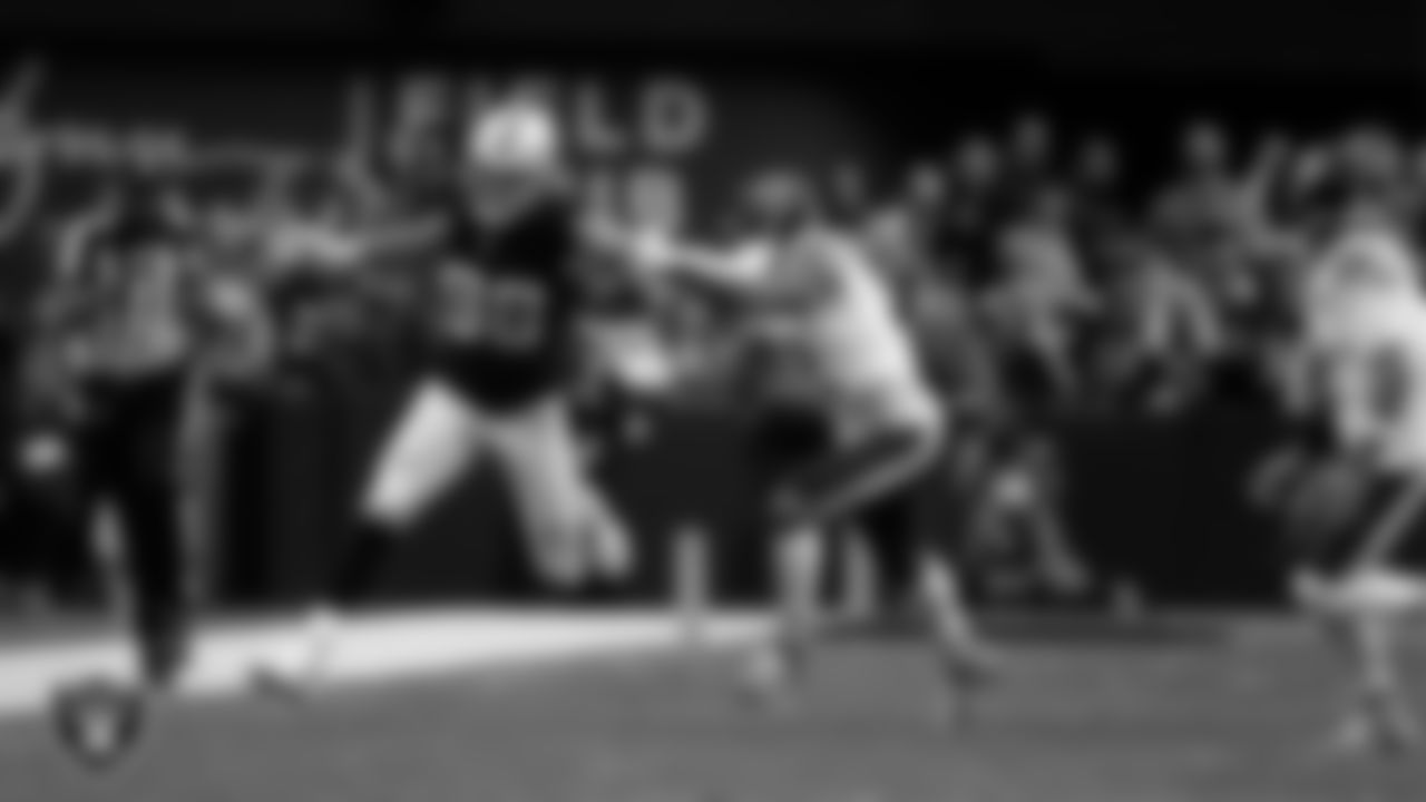 Las Vegas Raiders defensive end Maxx Crosby (98) runs after making an interception during the regular season home game against the Chicago Bears at Allegiant Stadium.