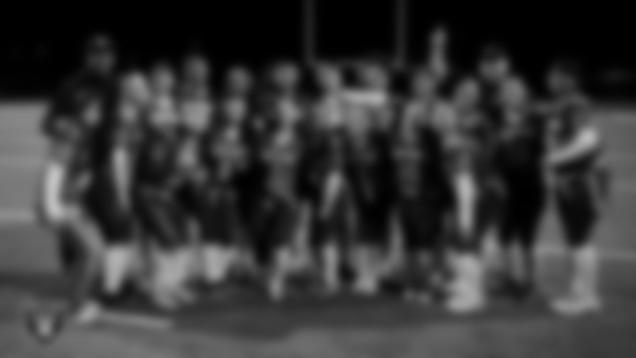 The Green Valley High School flag football team poses for a photo after the Las Vegas Raiders' High School Flag Football Showcase game at Green Valley High School.