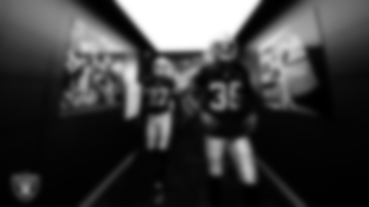 Las Vegas Raiders safety Tristin McCollum (27) and cornerback Kyu Blu Kelly (36) walk down the tunnel before the regular season home game against the Denver Broncos at Allegiant Stadium.