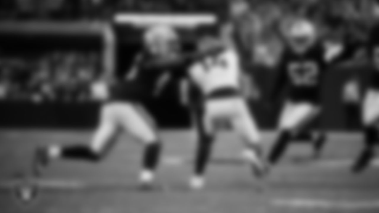 Las Vegas Raiders linebacker Devin White (45) makes a tackle during the regular season home game against the Denver Broncos at Allegiant Stadium.