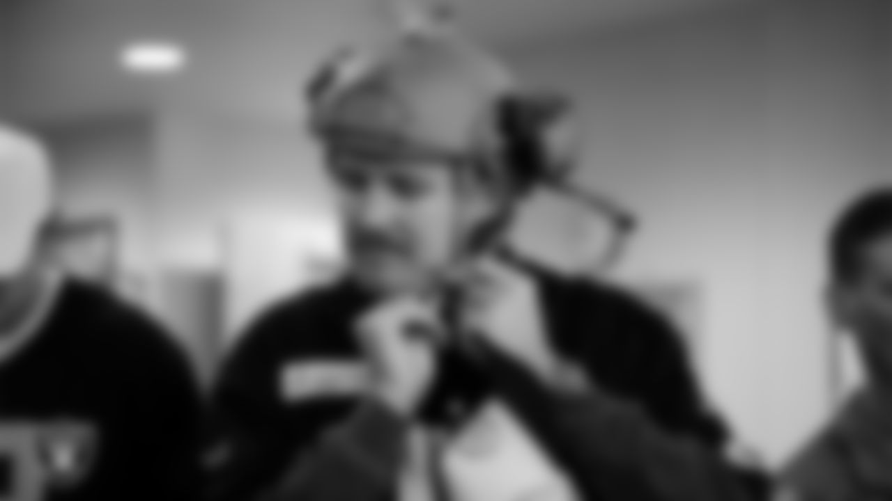 Las Vegas Raiders punter AJ Cole (6) tries on military equipment during a tour of Nellis Air Force Base.