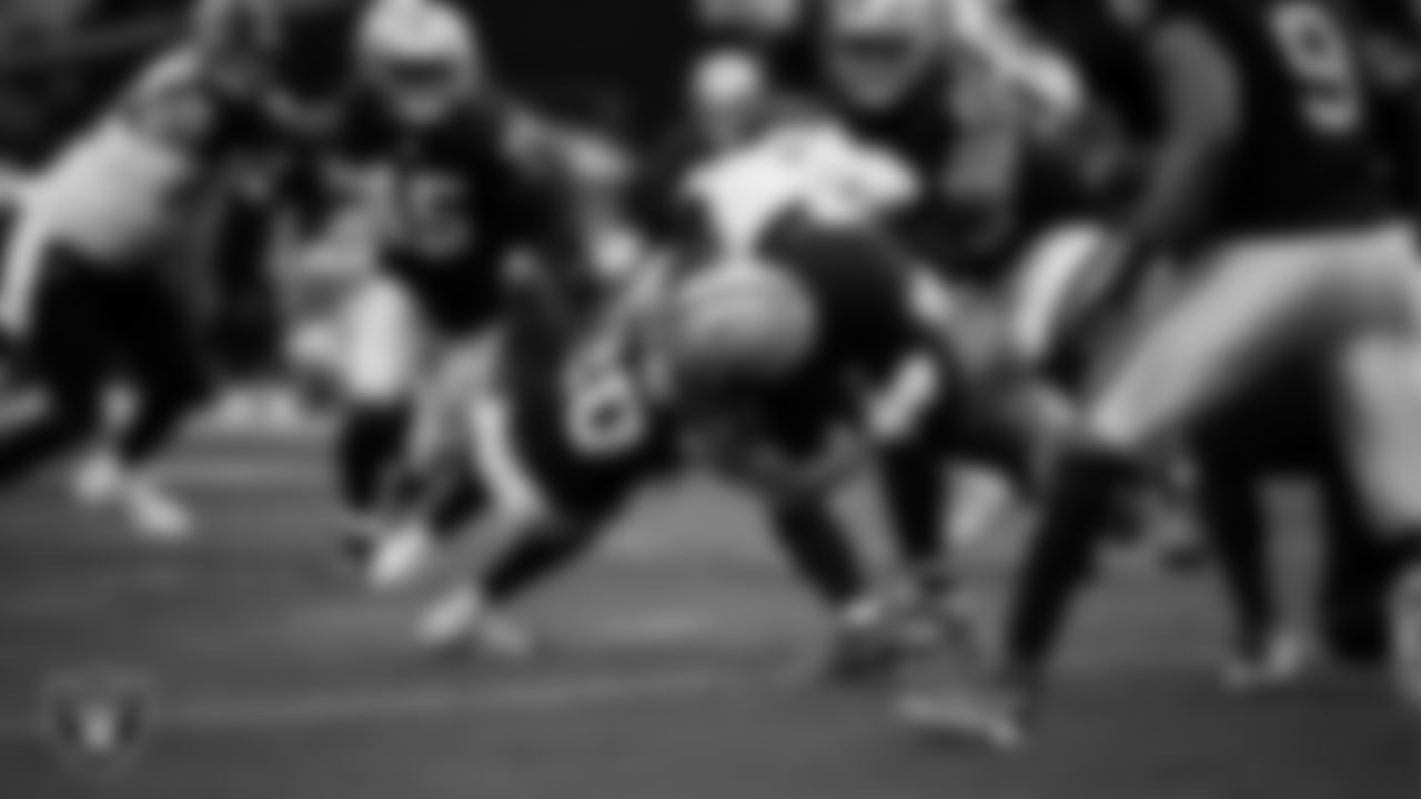 Las Vegas Raiders safety Isaiah Pola-Mao (20) makes a tackle during the regular season home game against the Jacksonville Jaguars at Allegiant Stadium.