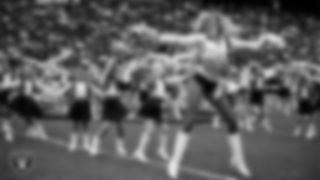 Raiderette Jordie and Junior Raiderettes perform on the field before the preseason home game against the San Francisco 49ers at Allegiant Stadium.