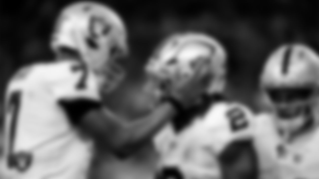 Las Vegas Raiders running back Ashton Jeanty (2) celebrates with quarterback Geno Smith (7) after making a 60-yard touchdown catch during the regular season away game against the Houston Texans at NRG Stadium.