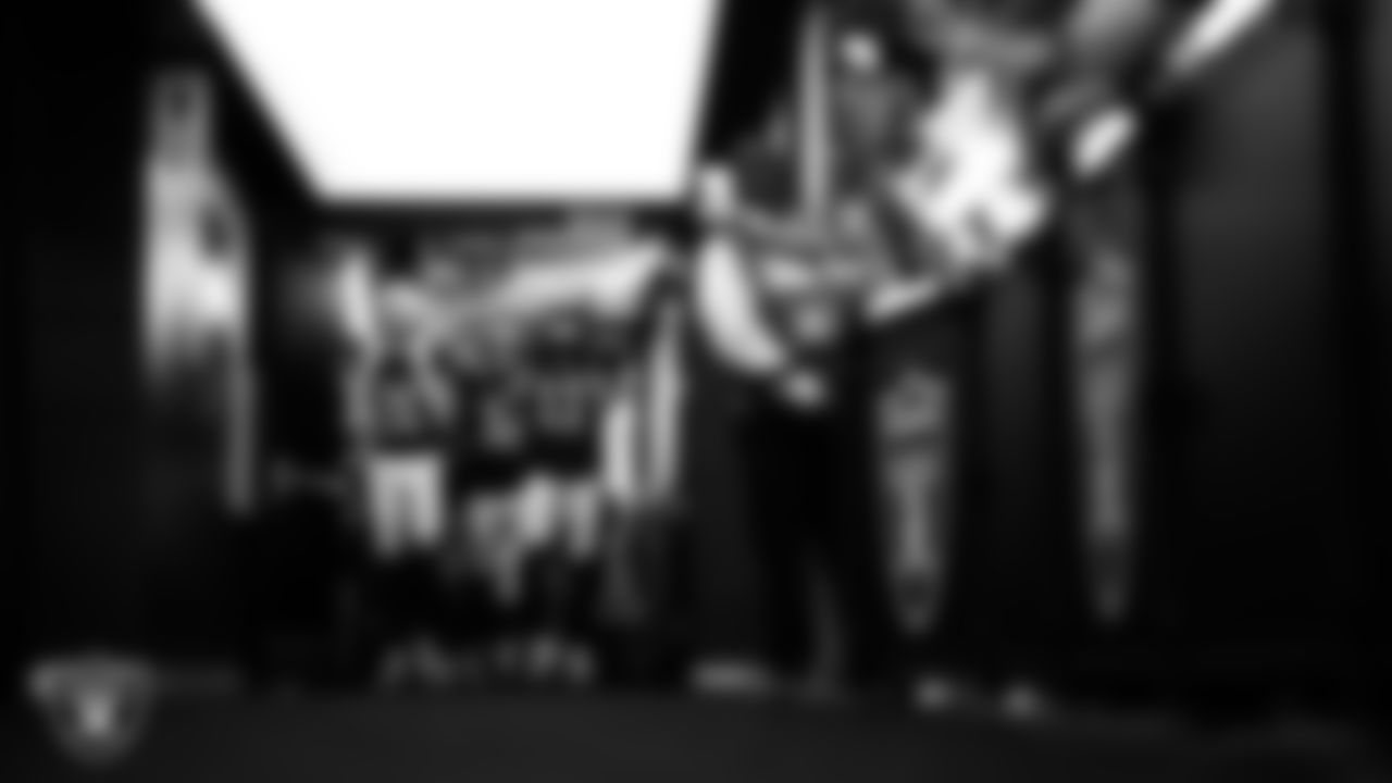 Las Vegas Raiders safety Isaiah Pola-Mao (20), safety Lonnie Johnson Jr. (32) and safety Jeremy Chinn (11) walk down the tunnel before the regular season home game against the Dallas Cowboys at Allegiant Stadium.