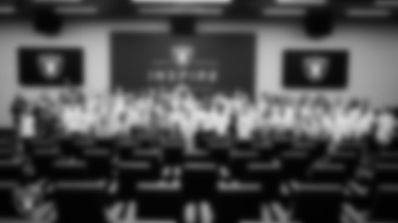 Four time NAIA flag football national champion Hailee McKay, Thomas University flag football player Dyva Jones and USA Women's Flag Football National team member Maci Joncich pose for a photo with high school flag football all-star players during the Las Vegas Raiders INSPIRE event at Intermountain Health Performance Center.