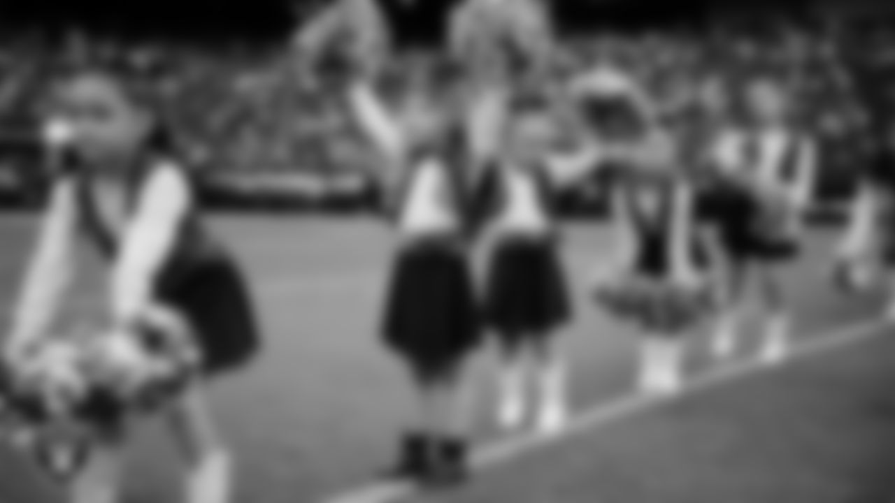 Junior Raiderettes perform on the field before the preseason home game against the San Francisco 49ers at Allegiant Stadium.