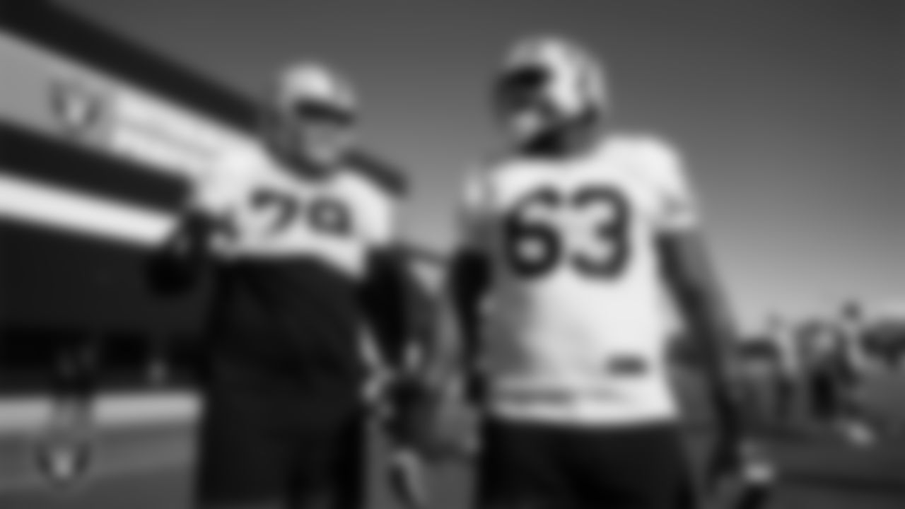 Las Vegas Raiders tackle Dalton Wagner (78) and guard McClendon Curtis (63) during practice at Intermountain Health Performance Center.