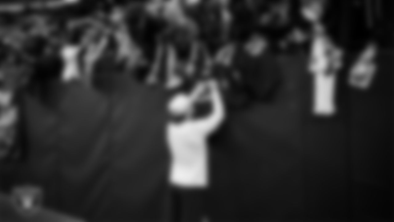 Las Vegas Raiders running back Dylan Laube (23) signs autographs for fans before the regular season home game against the Cleveland Browns at Allegiant Stadium.