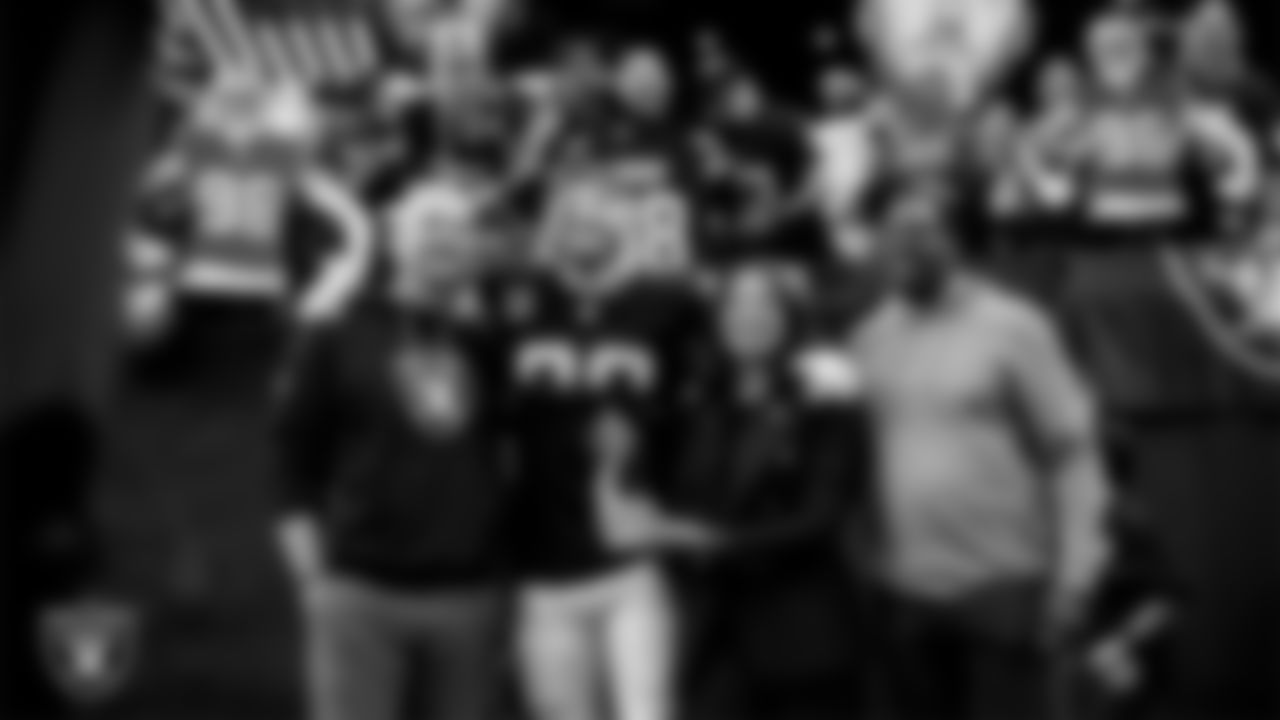 Las Vegas Raiders defensive end Maxx Crosby (98) is awarded the nomination as the Raiders' Walter Payton Man of the Year Award before the regular season home game against the Denver Broncos at Allegiant Stadium.