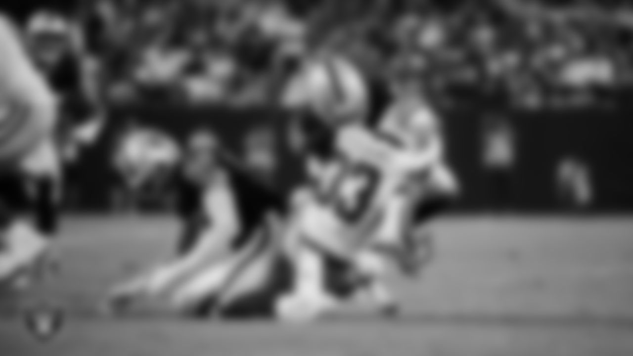 Las Vegas Raiders linebacker Elandon Roberts (52) makes a tackle during the regular season home game against the Dallas Cowboys at Allegiant Stadium.