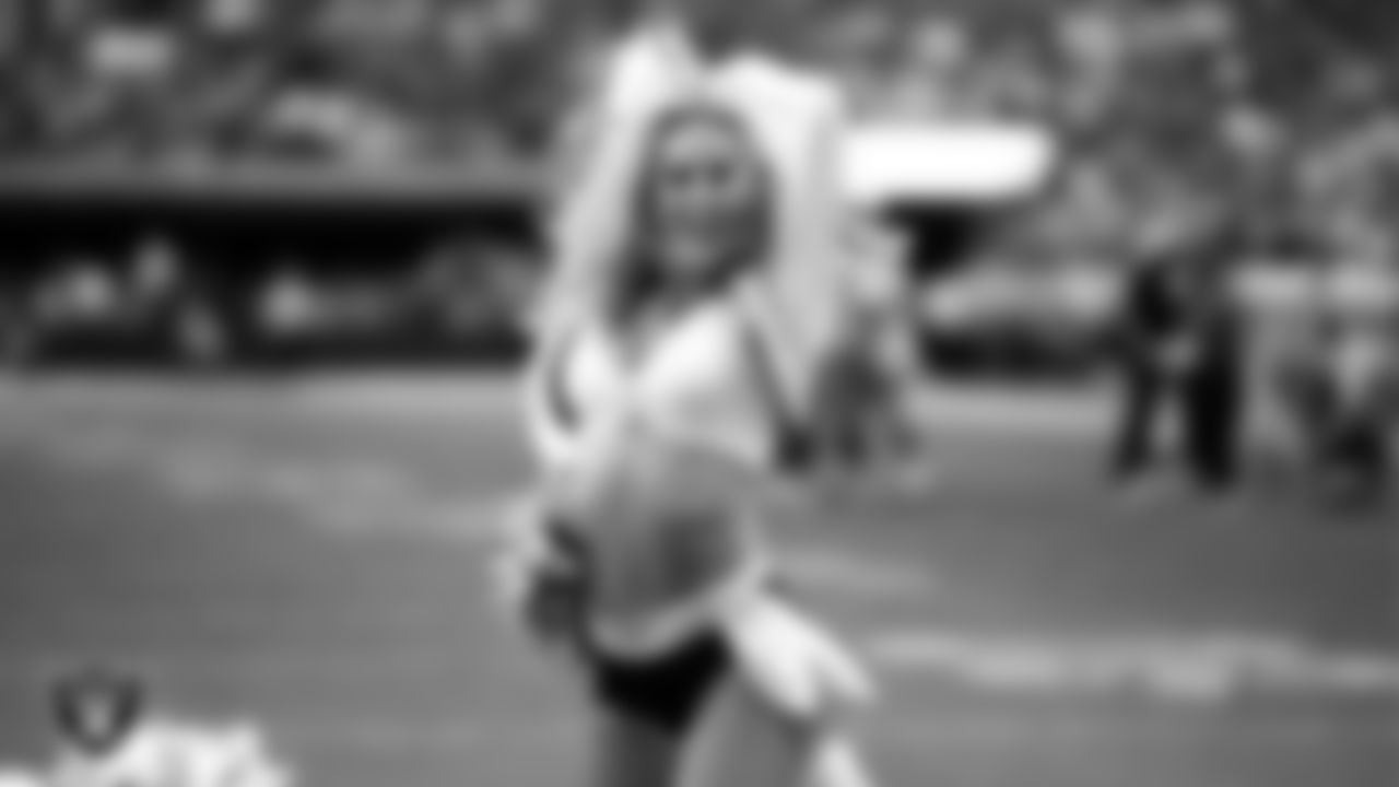 Raiderette Jessica performs on the field during the preseason home game against the San Francisco 49ers at Allegiant Stadium.