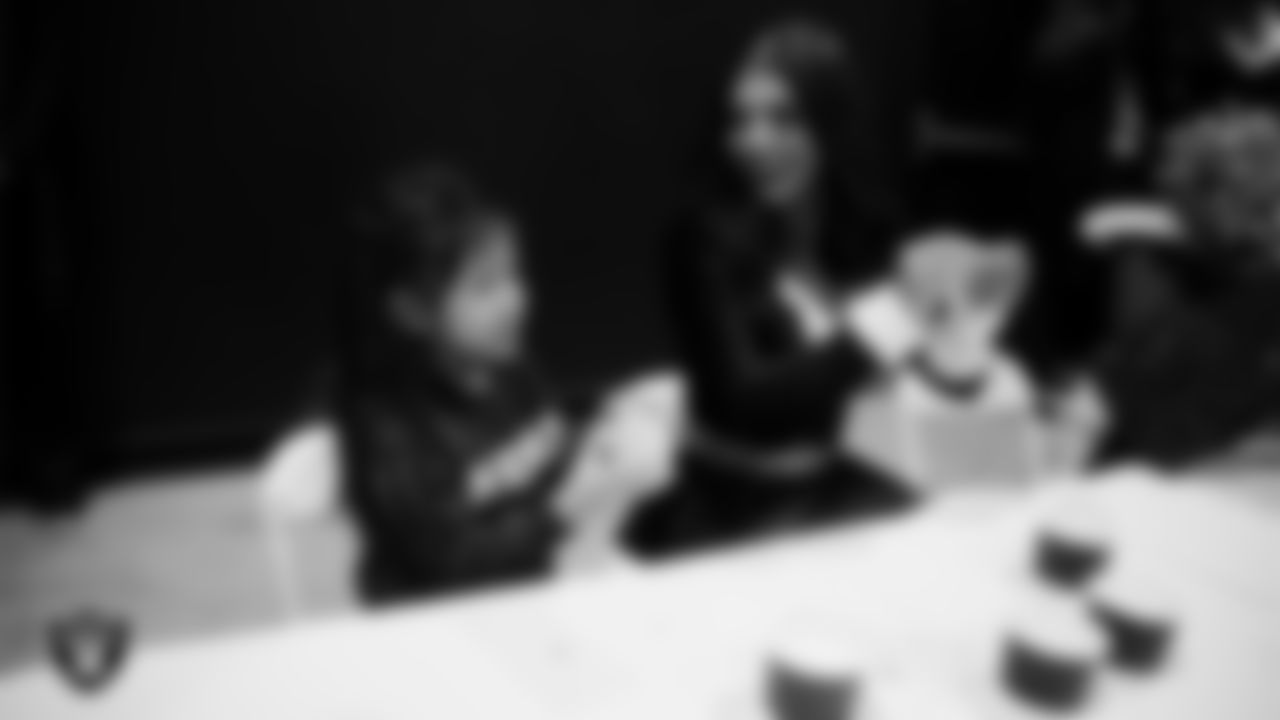 Raiderette Ashtin and a Junior Raiderette enjoy activities during the Junior Raiderettes Banquet at The Studio.