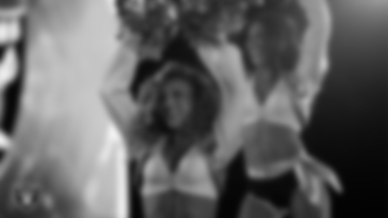 Raiderette Lexie performs with Rapper Nelly at halftime during the regular season home game against the Dallas Cowboys at Allegiant Stadium.