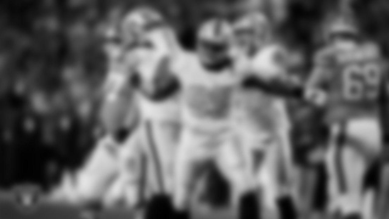 Las Vegas Raiders defensive tackle Adam Butler (69) celebrates after sacking the quarterback during the regular season away game against the Denver Broncos at Empower Field at Mile High.