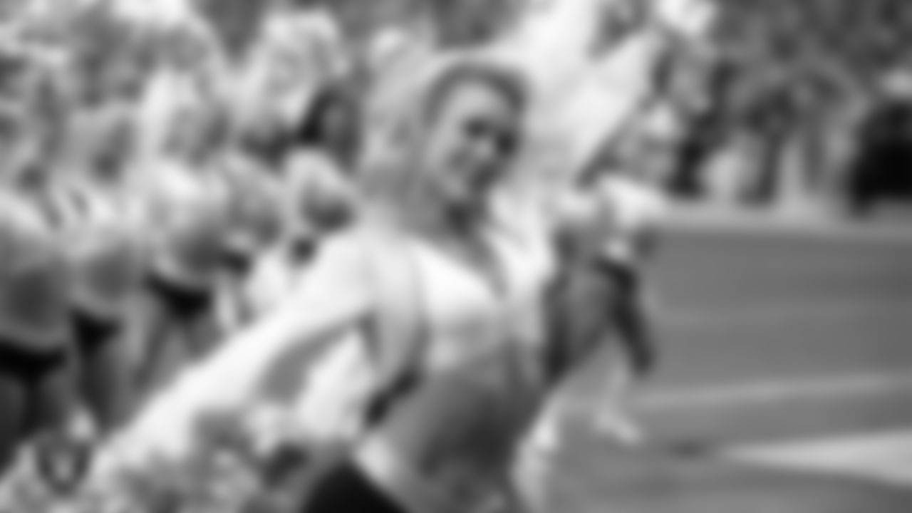 Raiderette Kennedy performs on the field during the preseason home game against the San Francisco 49ers at Allegiant Stadium.