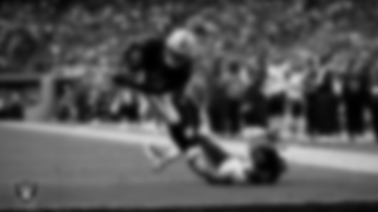 Las Vegas Raiders running back Ashton Jeanty (2) runs after making an 8-yard touchdown catch during the regular season home game against the Chicago Bears at Allegiant Stadium.